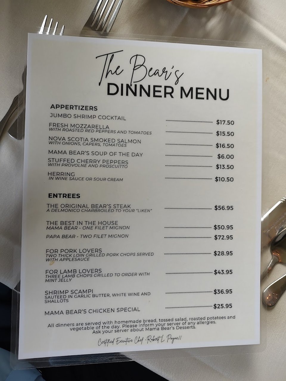 Printed steakhouse menu with seafood and steak choices.